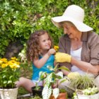 Enjoy Container Gardening, Not Lawn Chores Grandmother daughter in garden