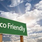 Building a New Home? 10 Can’t-Live-Without Features Eco Friendly Green Road Sign Against Dramatic Clouds, Sky and Sun Rays.