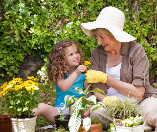 Multiple generations working in a community garden