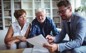 Is New Construction a Great Value for Savvy Homebuyers? - closing 4774 small Couple sitting down with agent discussing discounts