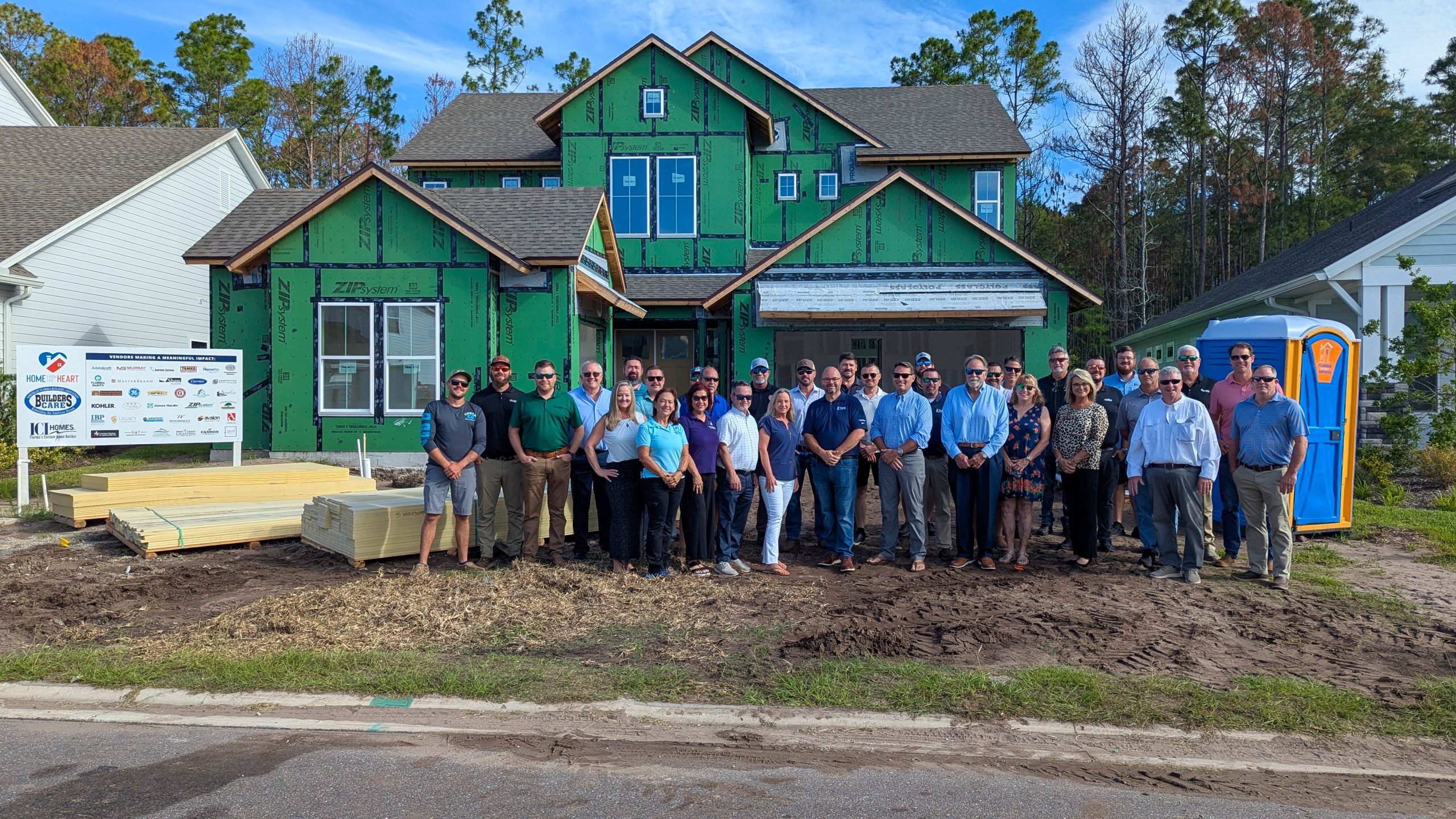 ICI Homes and Builder Care Reach Mid-Construction Milestone in Middlebourne - Mid Construction Event Group Photo scaled